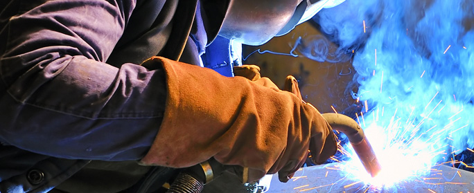 man welding with mask on